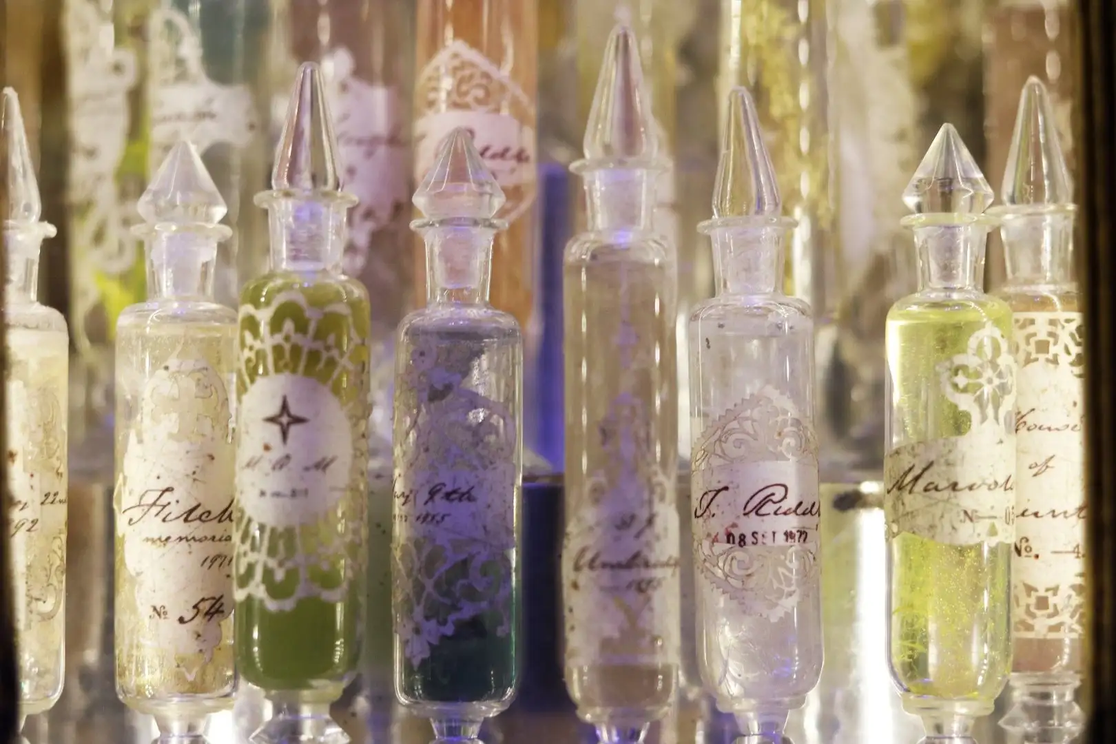 Memory Cabinet - Ornate glass memory vials with character name labels