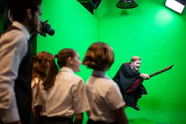 Student card - Students with broomstick on green screen