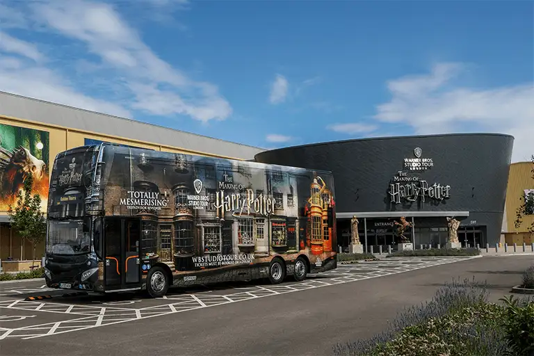 Tickets & Transfer Package - Warner Bros. Studio Tour London exterior with branded bus