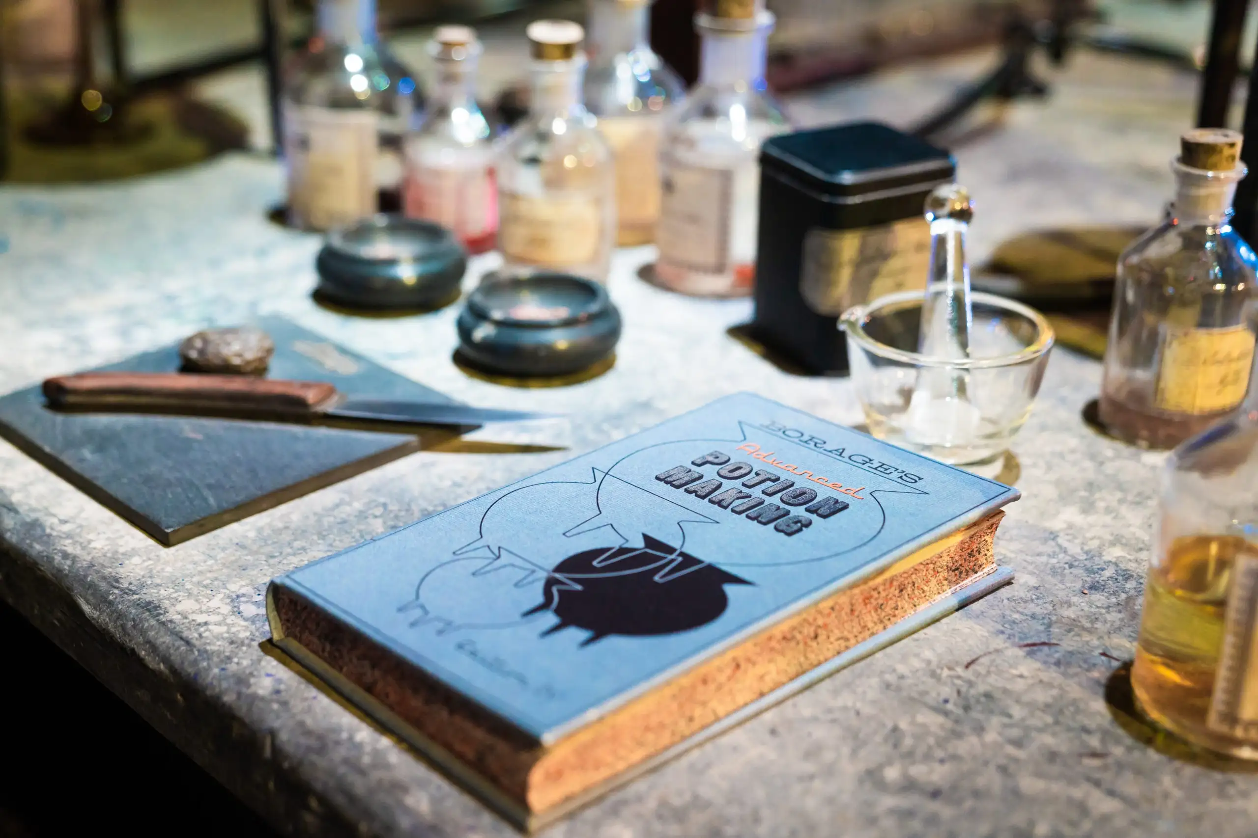 Activity Worksheets Hero - Potions textbook and bottles on the Studio Tour set