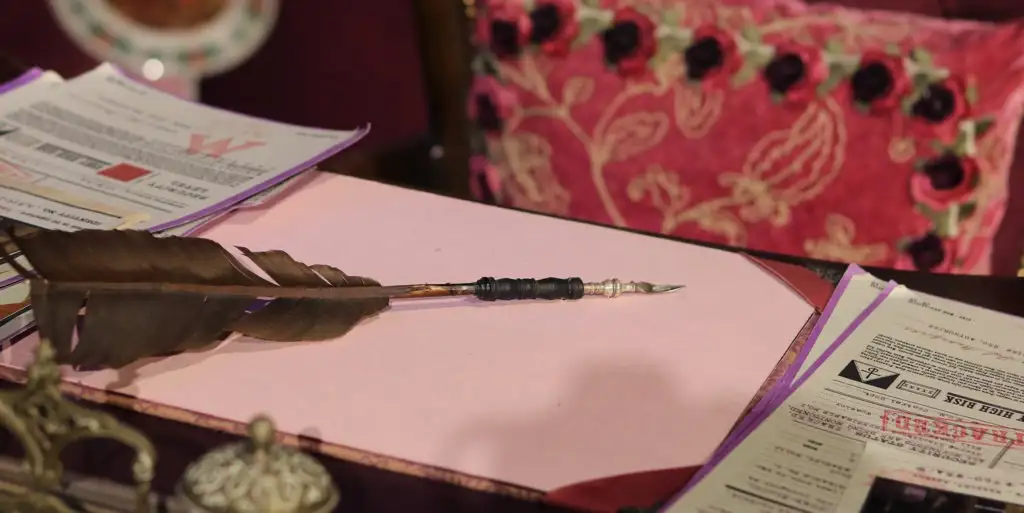 Screenplay Stories Hero - Feather quill pen and Ministry papers on Umbridge's desk