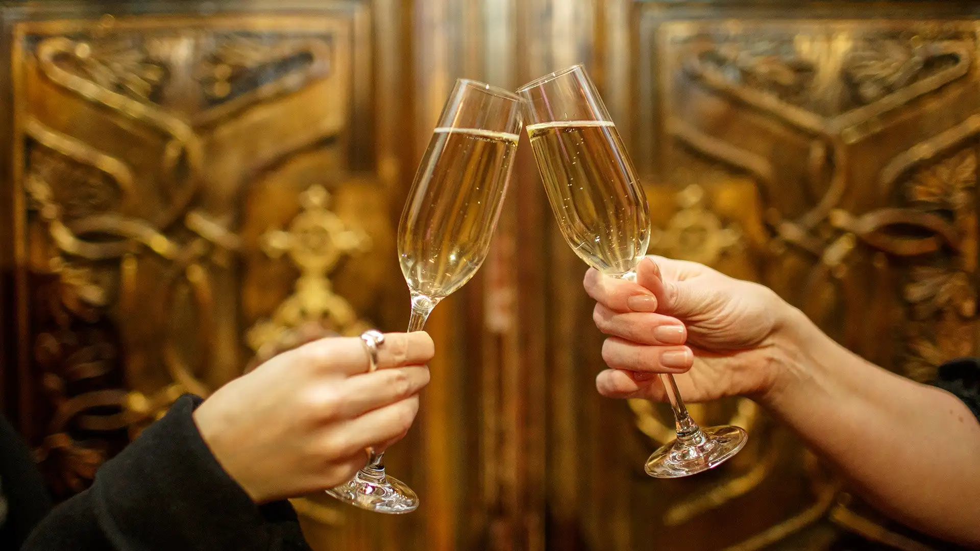 Twilight Tours - A pair of full champagne glasses in the Great Hall
