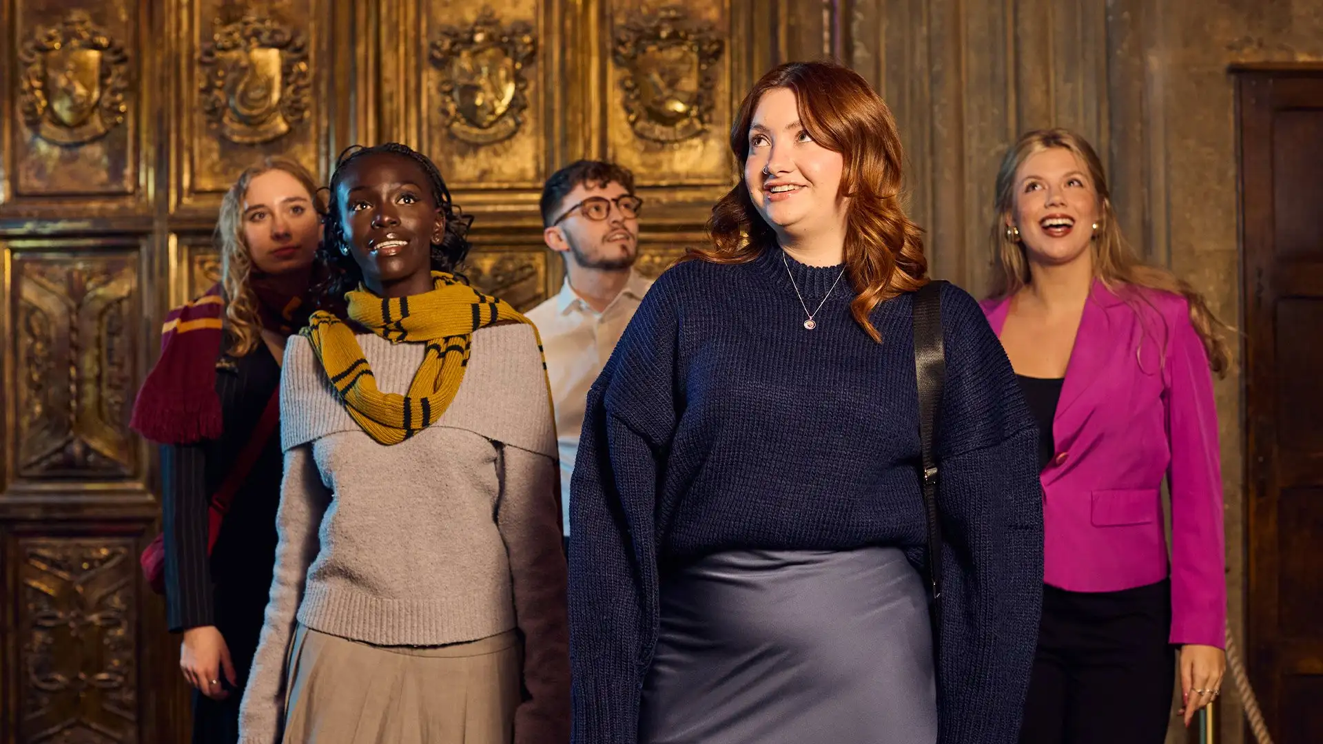 A group of visitors in the Great Hall set